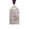 Decorative pendant with a religious design on a white background