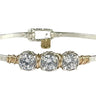 Silver bracelet with three clear gemstones on a white background
