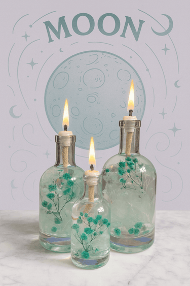 Three lit oil lamps in decorative bottles with floral designs against a celestial-themed background.