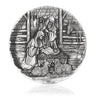 Decorative nativity scene coaster with a black and white nativity scene illustration.