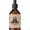 Brown glass bottle of Johnny Slicks Organic Beard Oil with a dropper on a white background