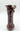 Decorative vase with wavy design on a white background