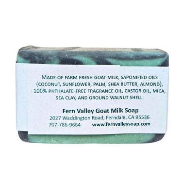 Green bar of Pacific Breeze sea mineral goat milk soap bar with a label on a white background