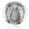 Decorative plate with pineapple and 'Welcome' text on a white background