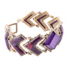 Bracelet with purple stones and gold accents on a white background