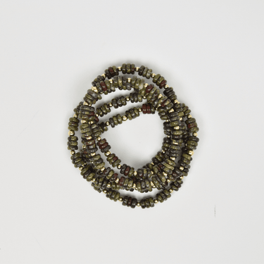 Beaded bracelet with multicolor beads on a light gray background