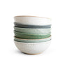 Set of four ceramic bowls with different color stripes on a white background