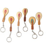 Set of wooden keychains with colorful designs on a white background