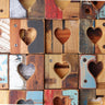 Wooden blocks with heart shapes arranged in a grid pattern.