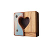 Wooden block with a heart-shaped cutout on a white background
