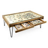 Wooden puzzle table with glass top and storage drawers on a white background