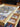 Jigsaw puzzle with missing pieces on a wooden tray with a drawer.