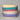 Stack of colorful ceramic bowls on a gray background