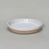 Ceramic dish with white rim and beige base on a gray background