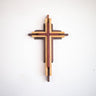 Wooden cross wall art on a white background