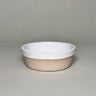 Ceramic bowl with white top and beige bottom on a gray background