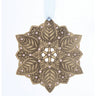 Decorative ornament with leaf pattern and pink beads on a white background