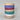 Stack of colorful ceramic bowls on a gray background