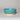 Teal ceramic bowl on a gray background