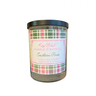 Candle with plaid label on a white background