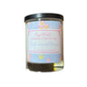 Candle with a floral label on a white background