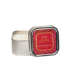 Spiced Pomegranate Soy Lotion Candle in a metal tin with a decorative red lid on a white background