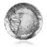Circular object with an engraved design of an eagle's head and American flag on a white background