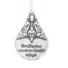 Decorative teardrop-shaped ornament with black floral design and text on a white background