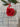 Red handcrafted porcelain rose on a textured fabric background