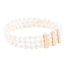 Pearl bracelet with a gold clasp on a white background
