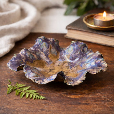 Handcrafted Porcelain Beach Bowl on a wooden surface with a candle and books in the background