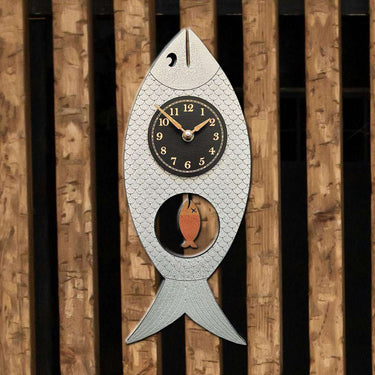 Wanda Wooden Fish Clock with Swinging Pendulum Wall Clocks Leonie Lacouette Clocks Silver on a wood wall Eclectic Treasures