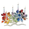 Wide Tree of Life Menorah, Rainbow Leaves with lit candles on a white background