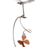 dragonfly silverware garden art with a butterfly made out of  recycled silverware on a white background